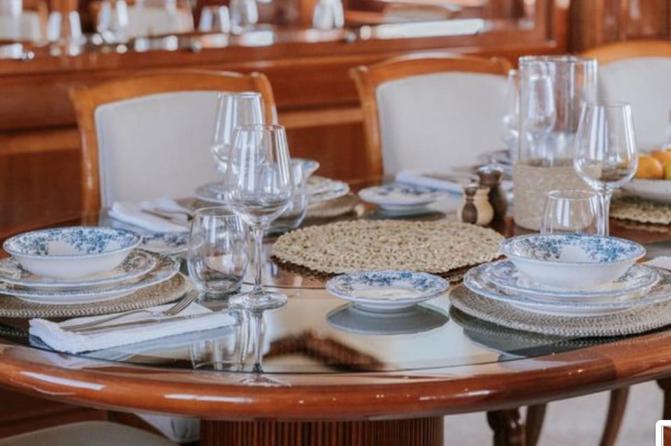 The dining table laid for dinner in the saloon