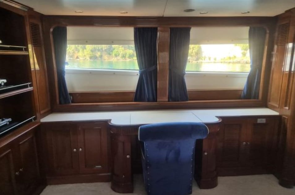 The master cabin desk beneath its windows