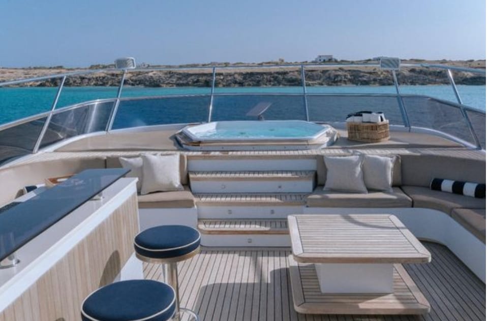 Sun deck teak table and spa pool, looking aft